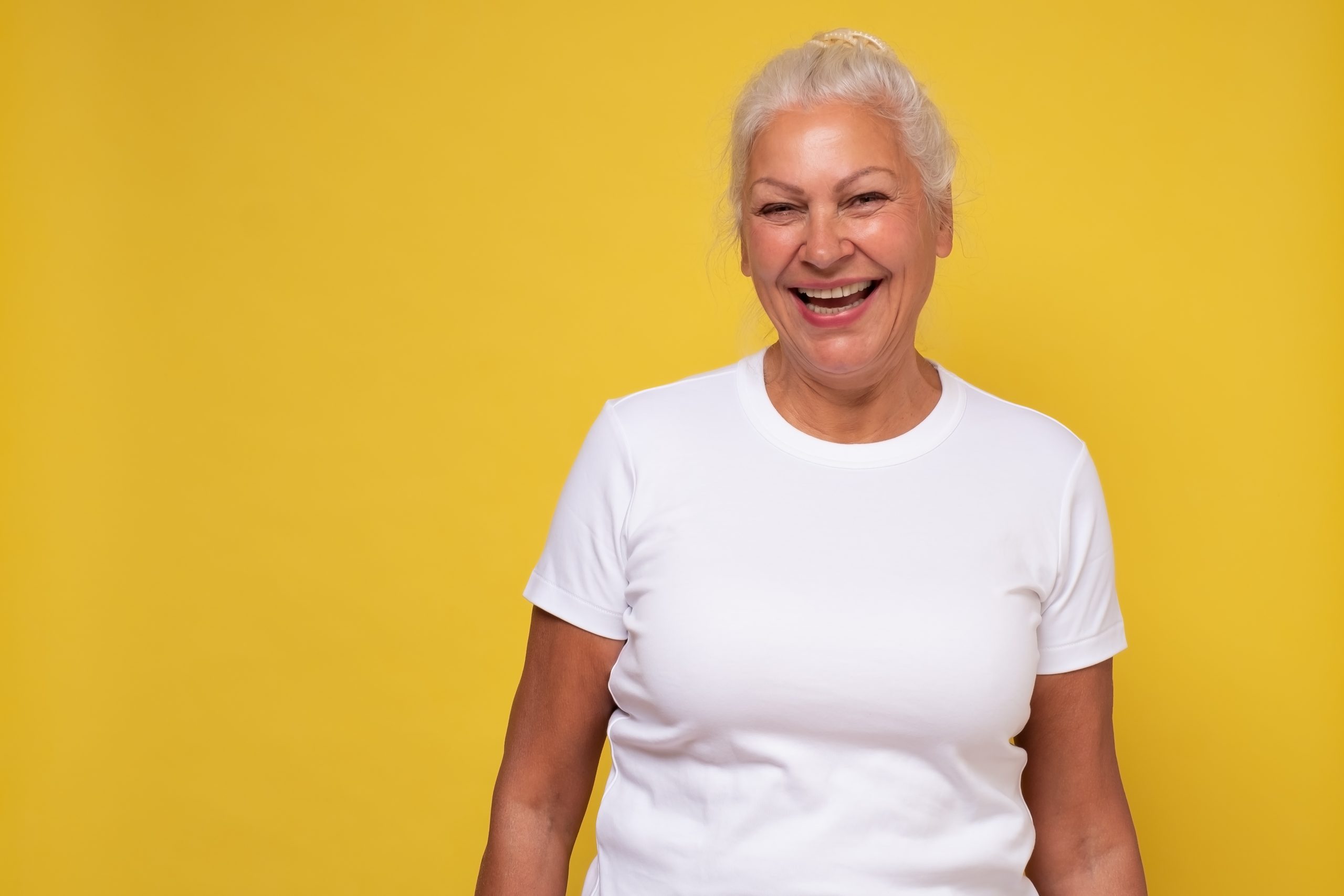 Beautiful elderly lady with a lively smile looking directly at the camera