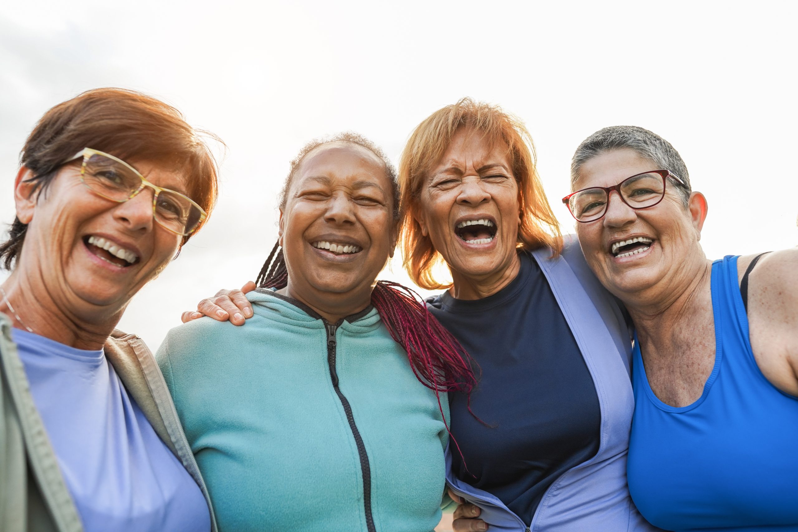 Multiracial senior women having fun together after sport workout